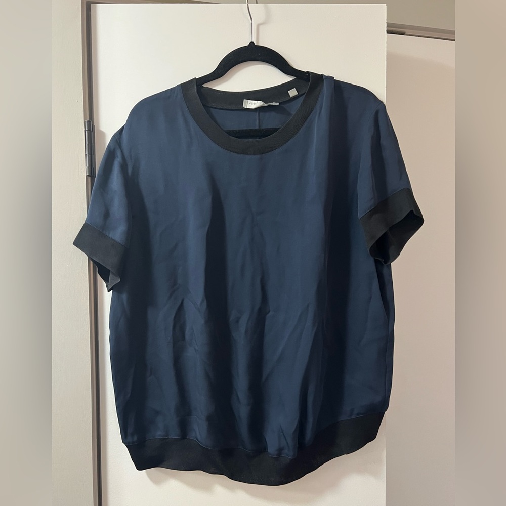 Navy silk blue Vince blouse with black trim. Size L